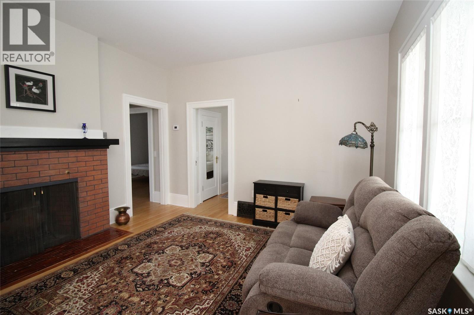 671 2Nd Street E, Shaunavon, SK - Indoor Photo Showing Living Room With Fireplace