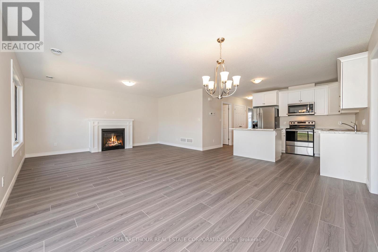 8 Sweet Water Drive, Ashfield-Colborne-Wawanosh, ON - Indoor Photo Showing Kitchen With Fireplace