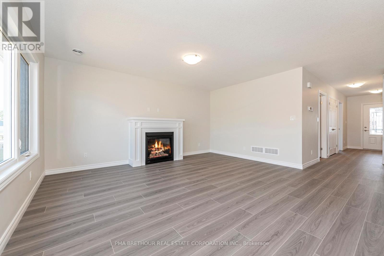 8 Sweet Water Drive, Ashfield-Colborne-Wawanosh, ON - Indoor Photo Showing Living Room With Fireplace