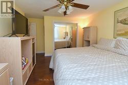 Primary Bedroom featuring mirror closet -