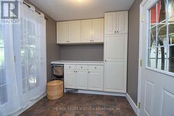 Laundry Room/ Mud Room leading to backyard -