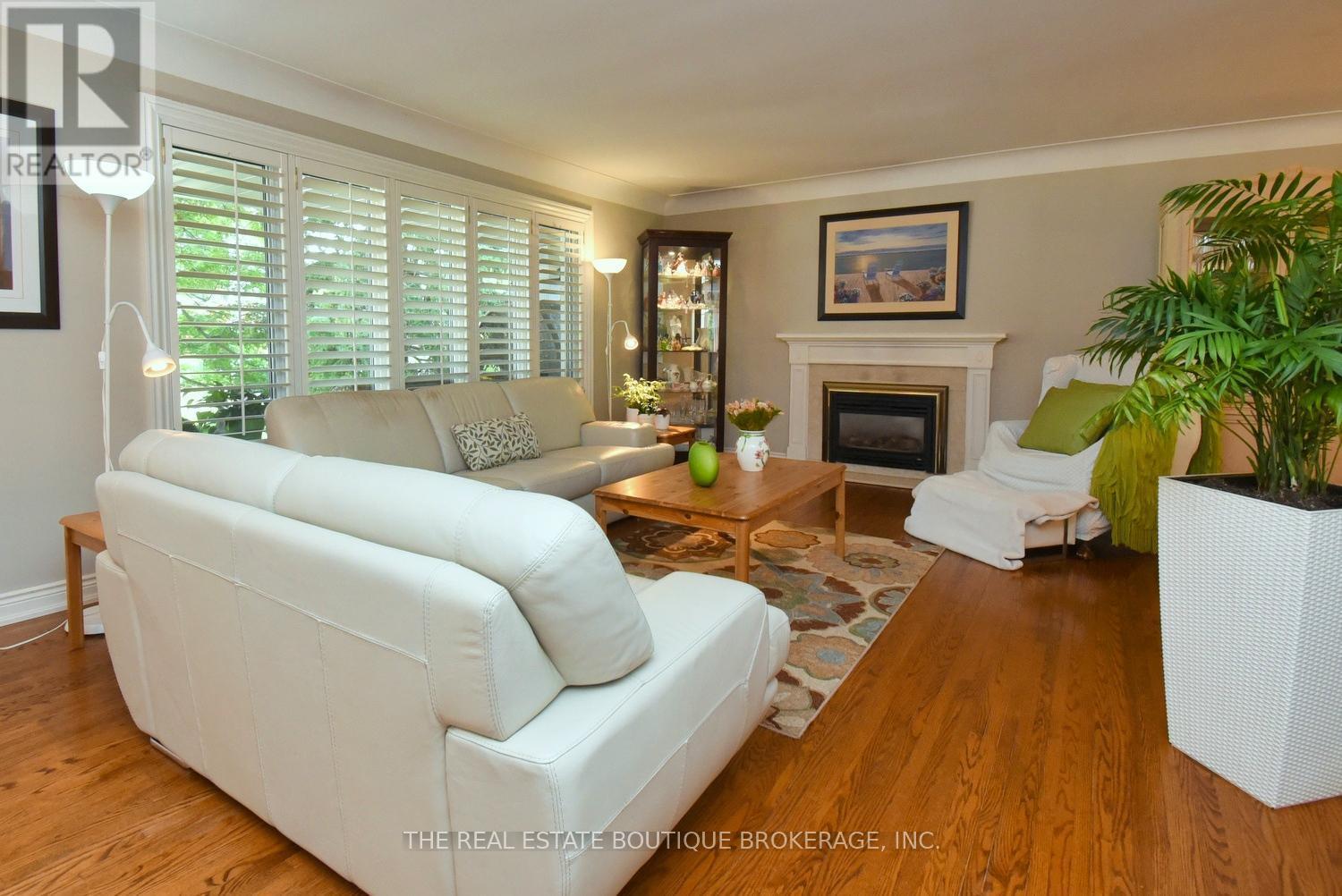 Bright Living Room featuring gas fireplace - 4131 Lorraine Crescent, Burlington, ON - Indoor Photo Showing Living Room With Fireplace