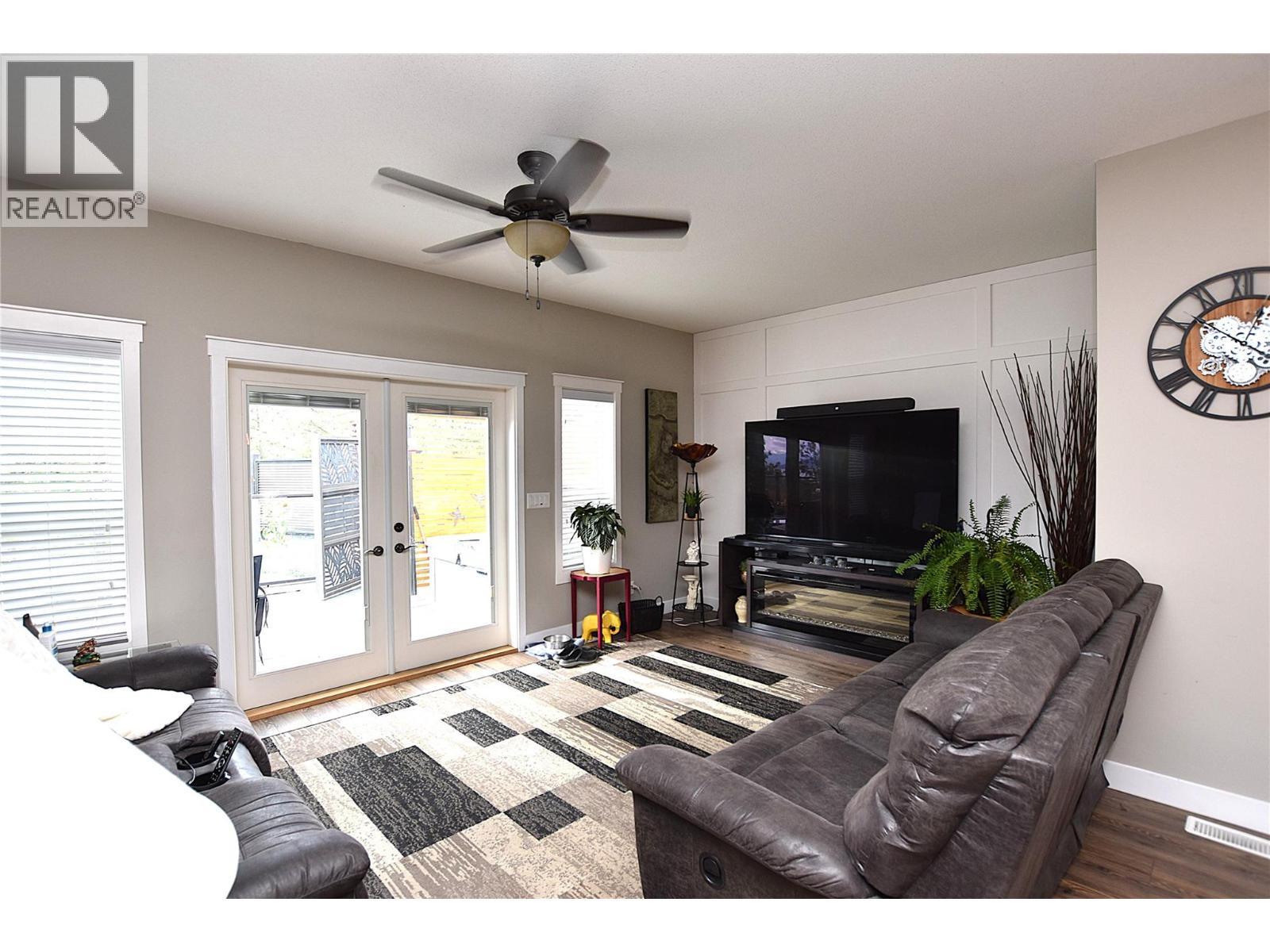 French doors to deck from the living room - 9510 Highway 97N Unit# 170, Vernon, BC