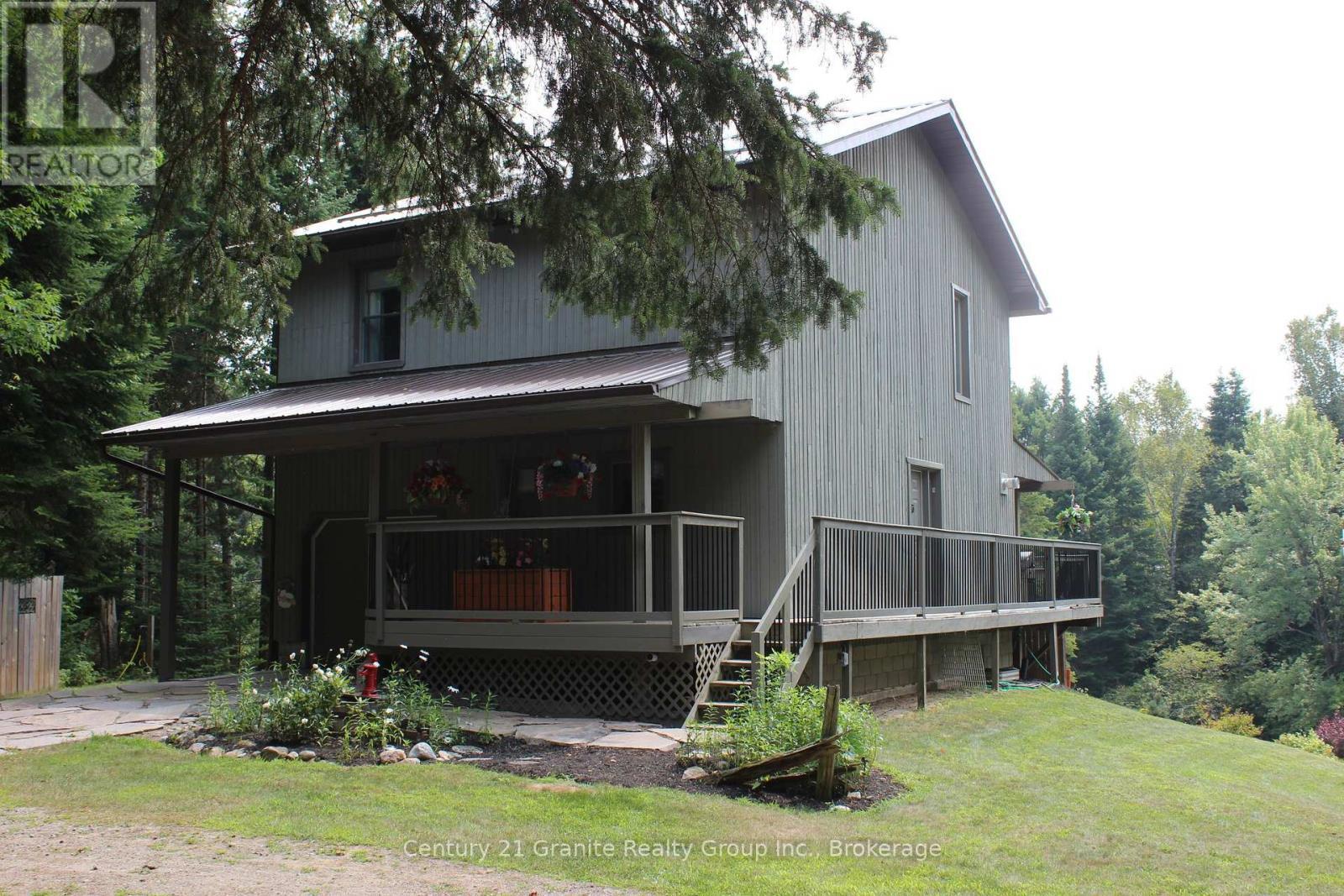 1082 Green Lake Road, Algonquin Highlands (Stanhope), ON - Outdoor With Deck Patio Veranda