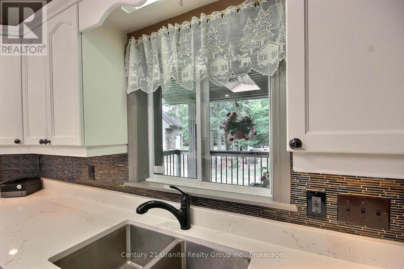 1082 Green Lake Road, Algonquin Highlands (Stanhope), ON - Indoor Photo Showing Kitchen With Double Sink