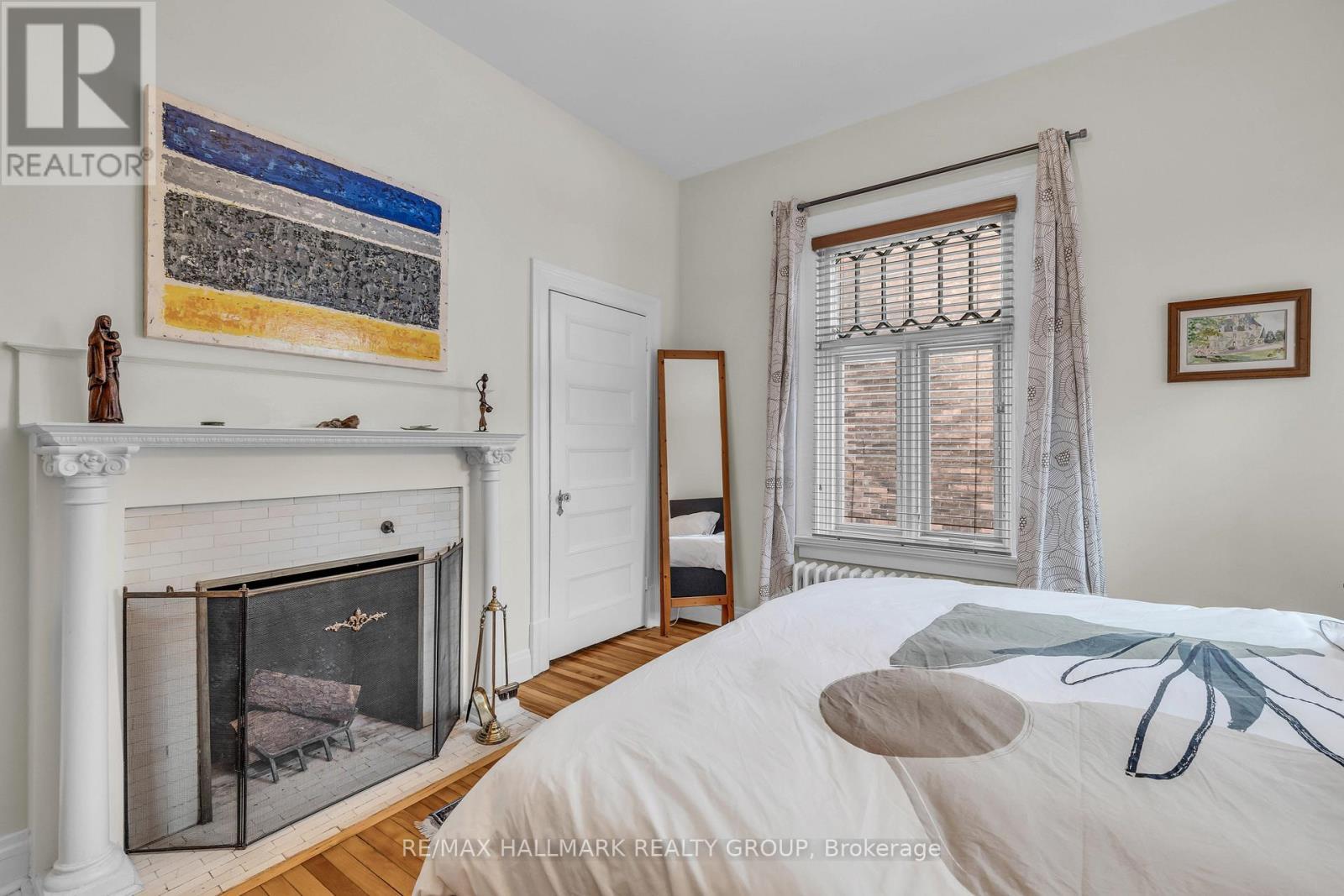 with wood burning fire place - 396 Daly Avenue, Ottawa, ON - Indoor Photo Showing Bedroom