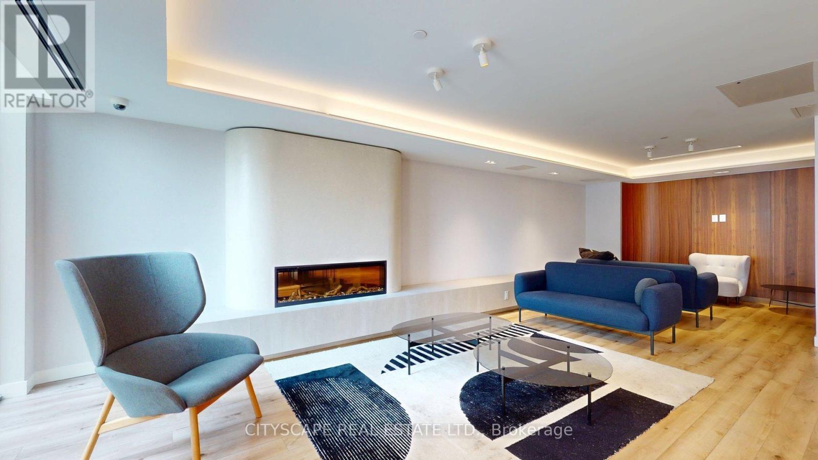 303 - 1195 The Queens Way, Toronto, ON - Indoor With Fireplace