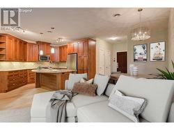 Living room to kitchen (photo has been virtually staged) -