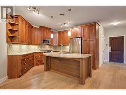 Lovely kitchen spacious island, granite counters and plenty of counter and cabinet space -