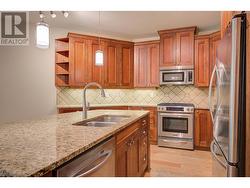 Lovely kitchen spacious island, granite counters and plenty of counter and cabinet space -
