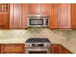 Lovely kitchen spacious island, granite counters and plenty of counter and cabinet space -