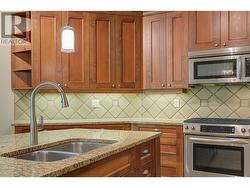 Lovely kitchen spacious island, granite counters and plenty of counter and cabinet space -