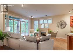 Living room with electric fireplace (photo has been virtually staged) -