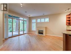 Living room with electric place and access to private covered patio -