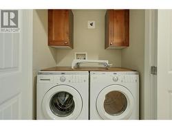 Laundry with cabinets for extra storage -