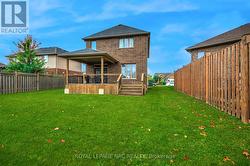 All brick home with partly covered deck. -