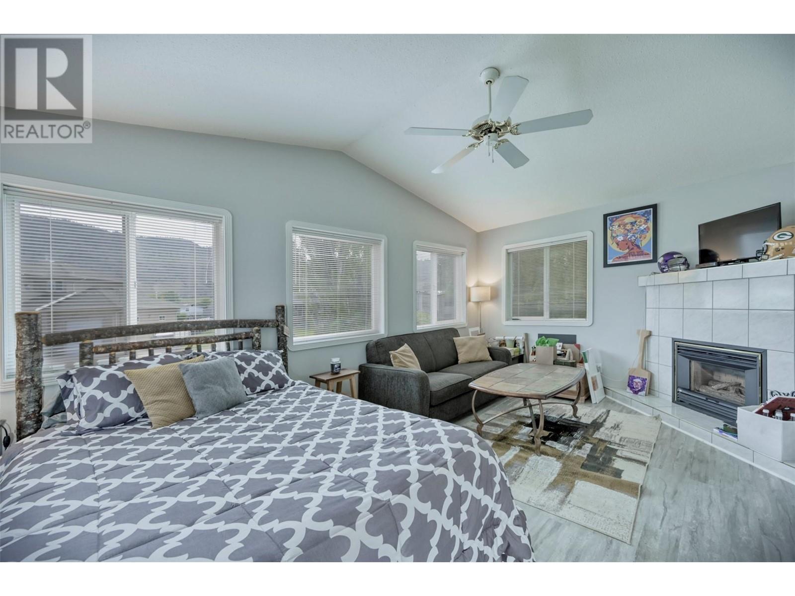 45 Harbour Key Drive, Osoyoos, BC - Indoor Photo Showing Bedroom With Fireplace