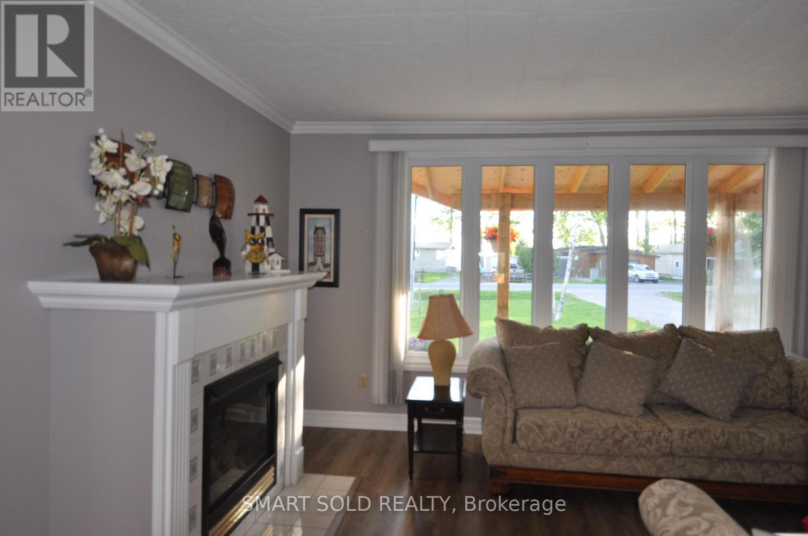 75 Lake Avenue, Ramara, ON - Indoor Photo Showing Living Room With Fireplace