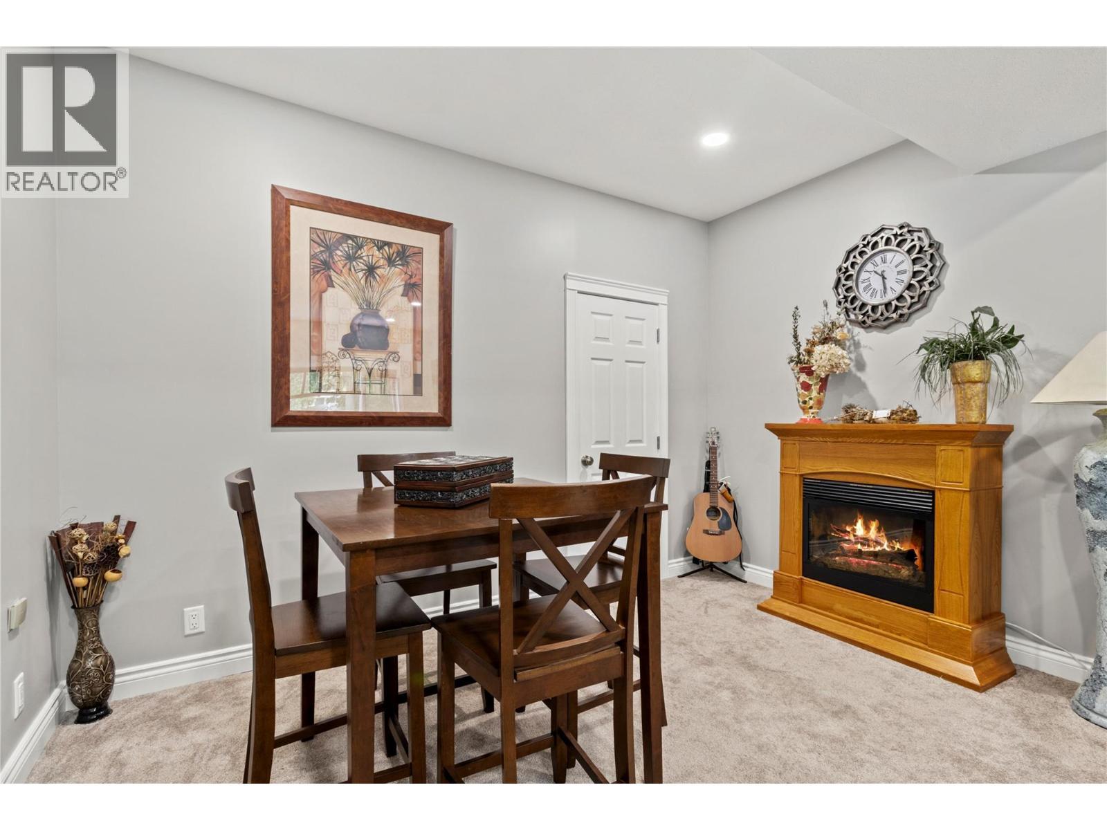 2746 Balmoral Road, Blind Bay, BC - Indoor Photo Showing Dining Room With Fireplace