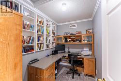 Office with built in book cases and desk -