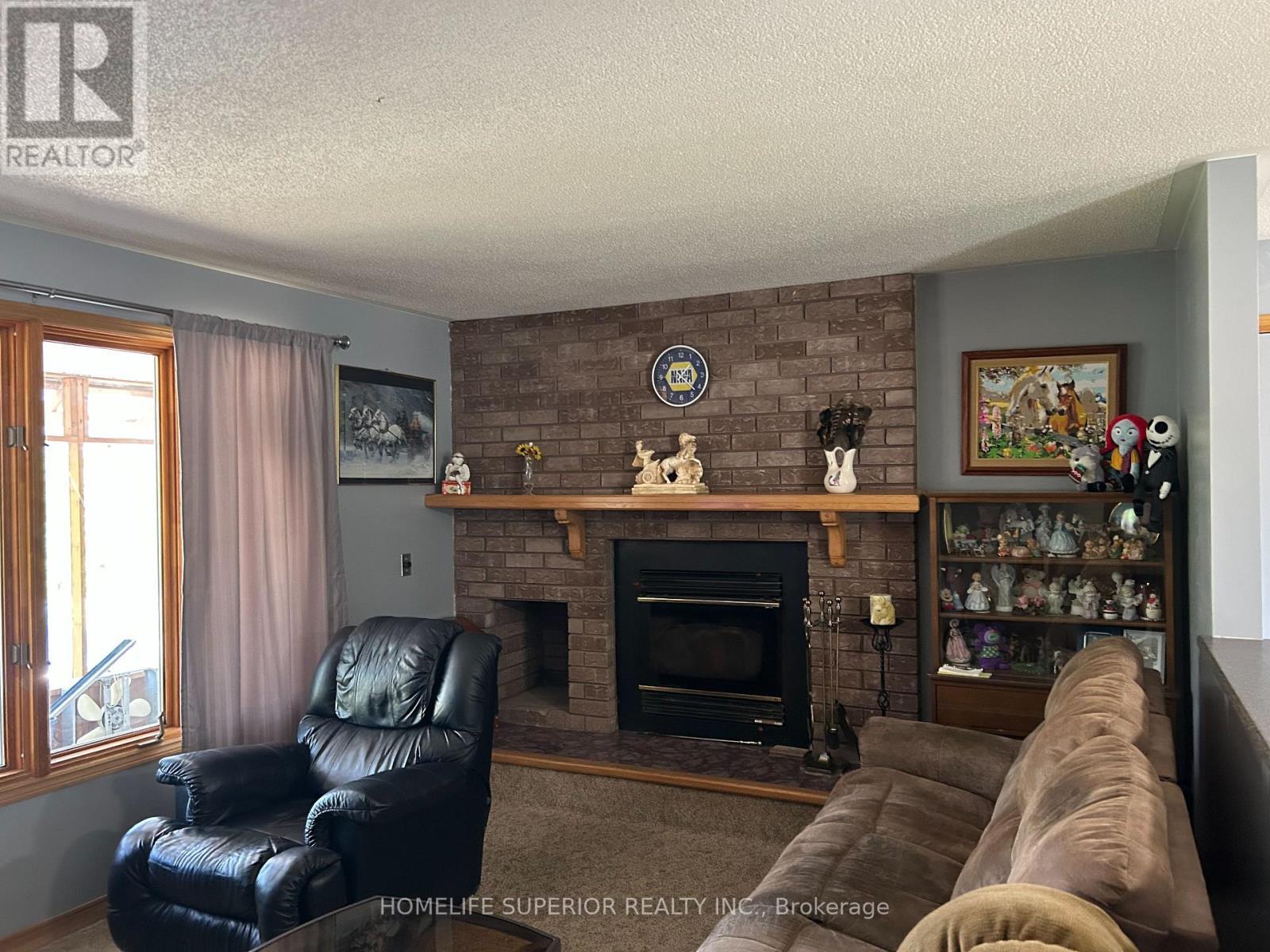1004 Bateman Road E, Stirling-Rawdon (Stirling Ward), ON - Indoor Photo Showing Living Room With Fireplace