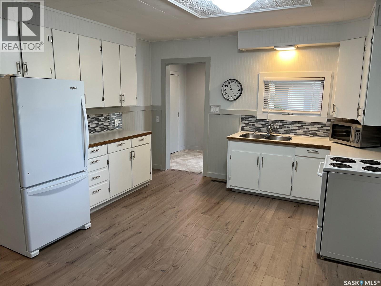 103 4Th Avenue E, Lafleche, SK - Indoor Photo Showing Kitchen With Double Sink