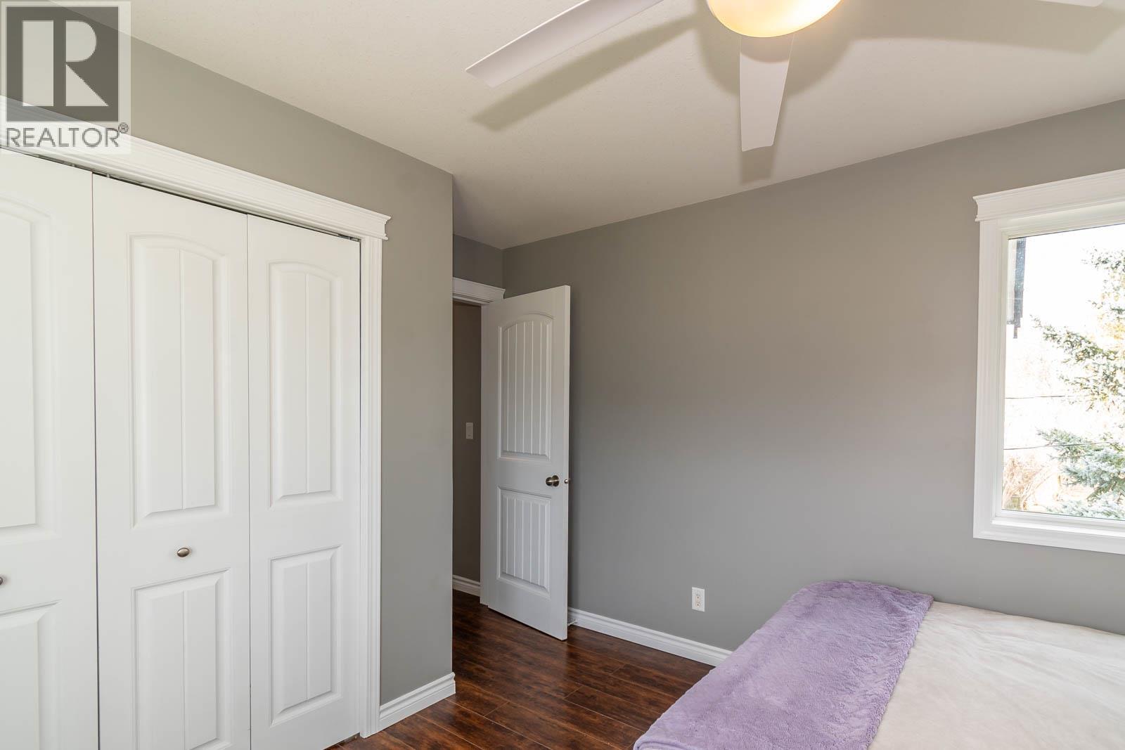 Main Floor Bedroom 2 - 2234 Tappen Notch Hill Road, Tappen, BC - Indoor Photo Showing Bedroom