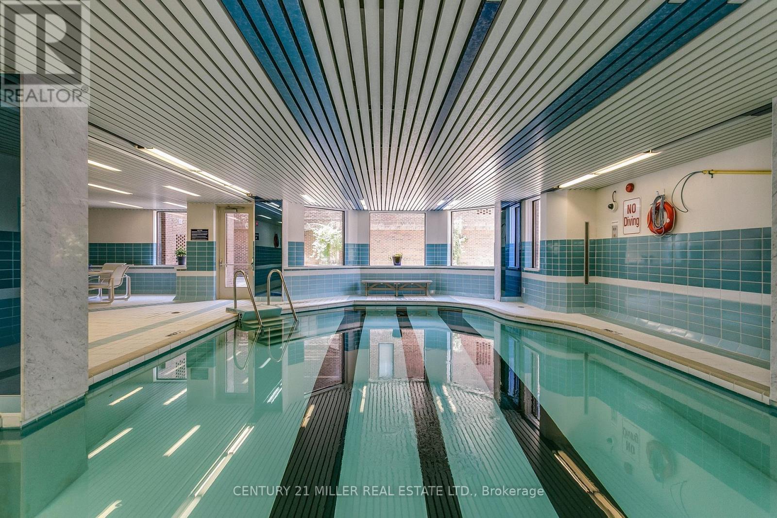 710 - 100 Lakeshore Road E, Oakville, ON - Indoor Photo Showing Other Room With In Ground Pool