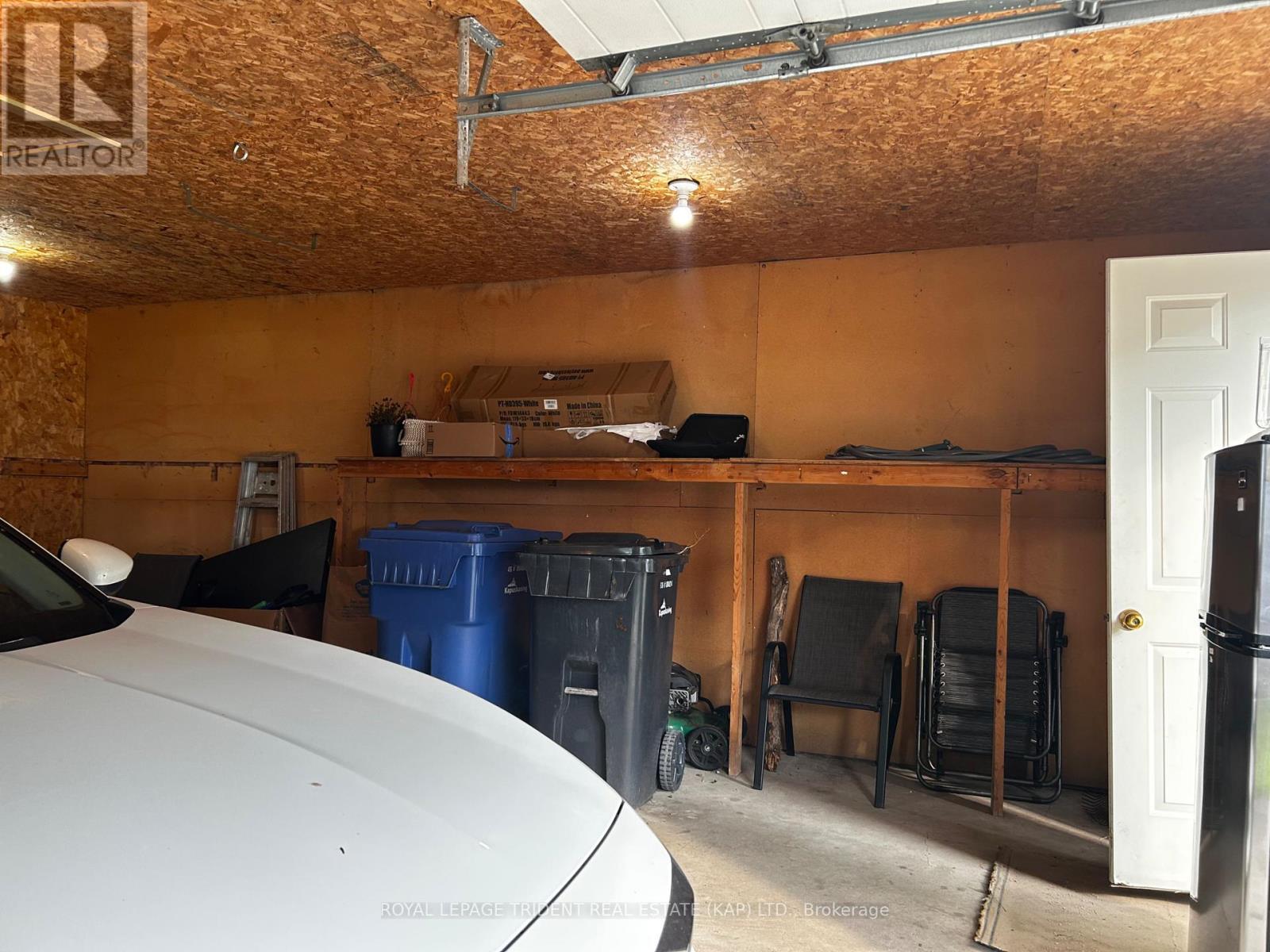 garage interior - 14 Niagara Street W, Kapuskasing, ON - Indoor Photo Showing Other Room