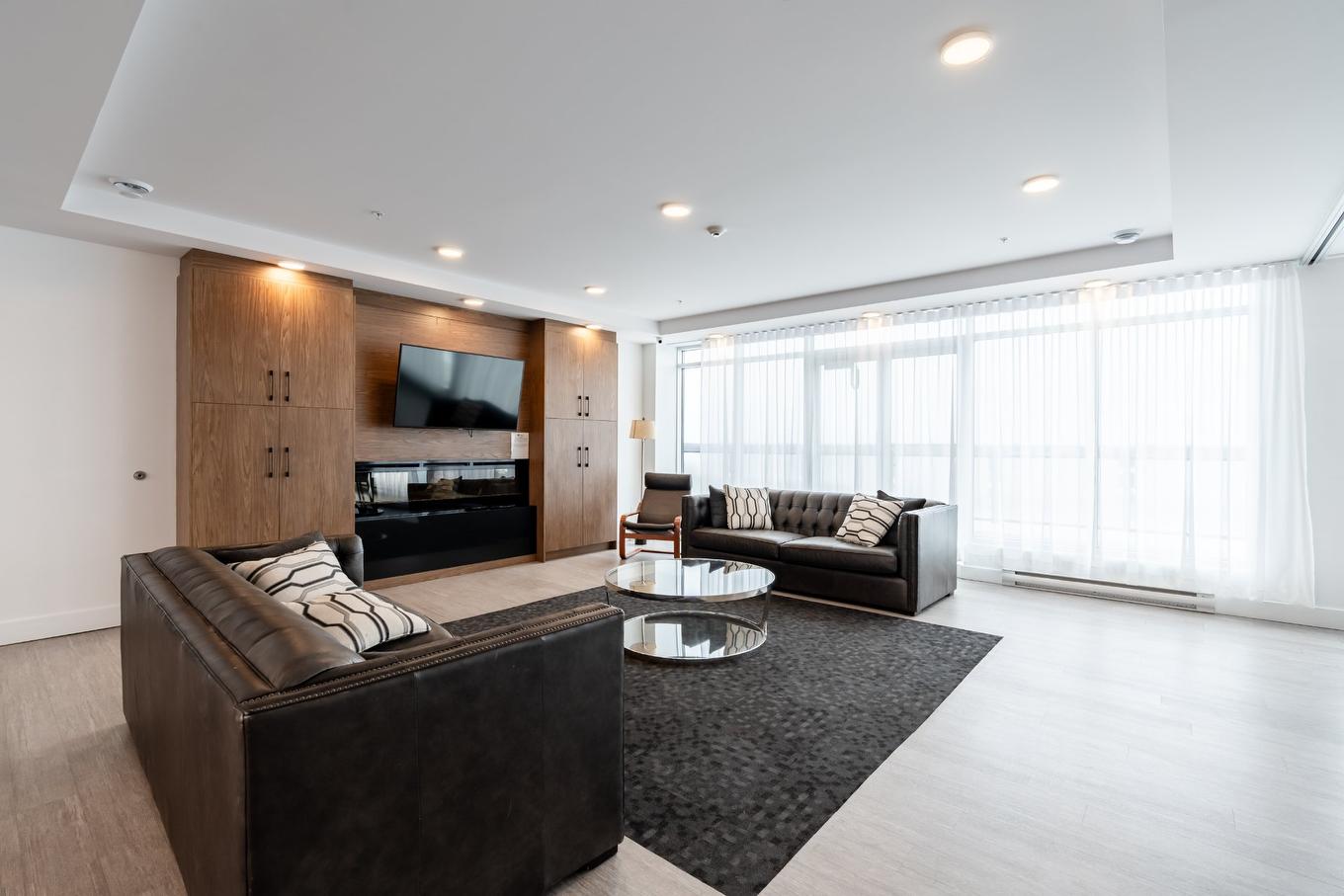 Common room - 109-9175 Rue Lennon, Brossard, QC - Indoor Photo Showing Living Room With Fireplace