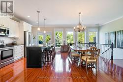 Kitchen & Dining rooms with walk-out to deck -