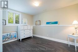 Guest bedroom in basement with large windows -