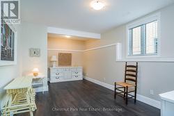 Guest bedroom in basement with large windows -