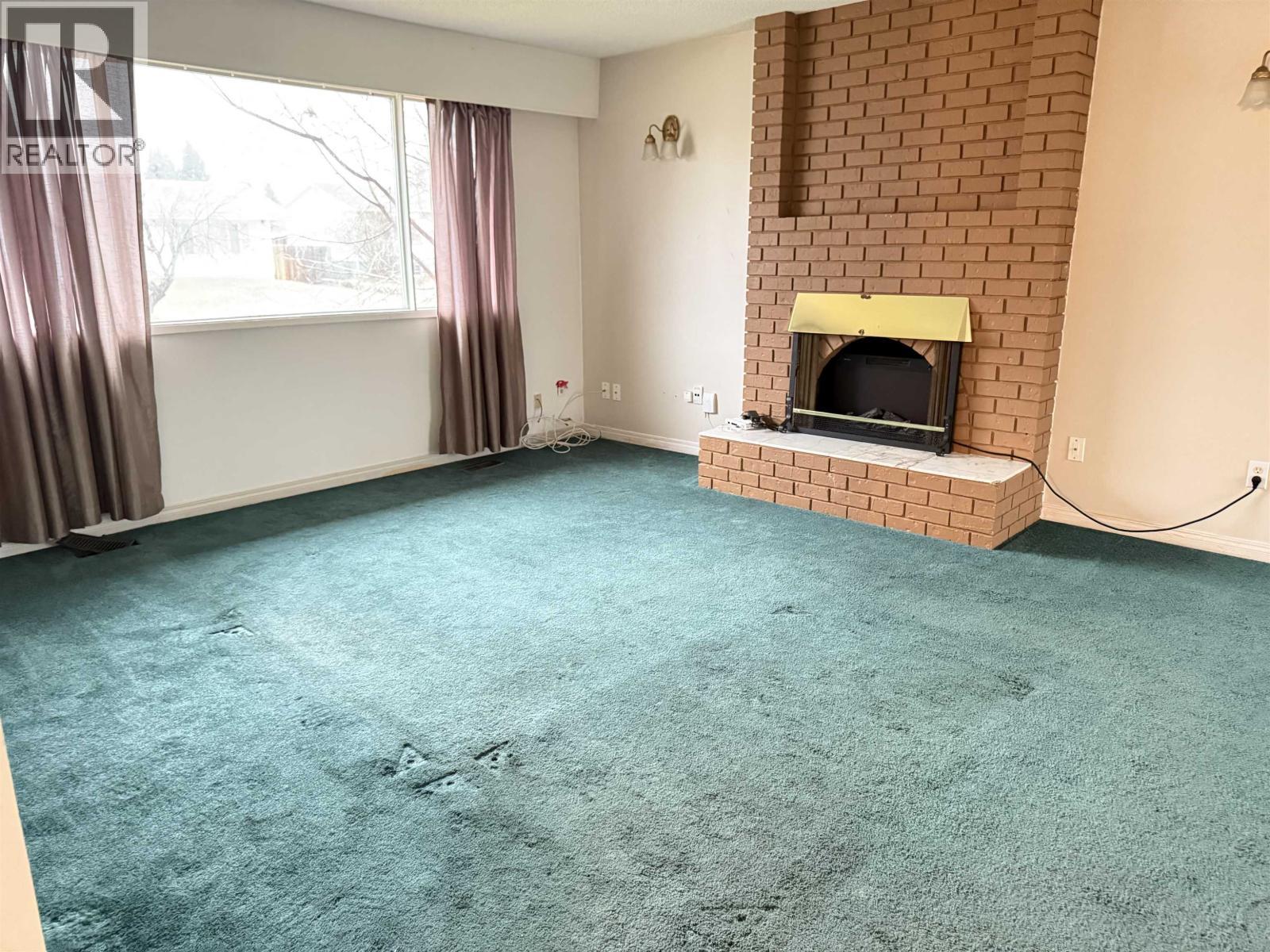 4565 1St Avenue, Prince George, BC - Indoor Photo Showing Living Room With Fireplace