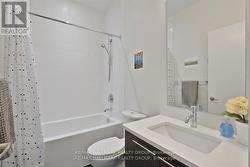 4 Piece Bathroom with Tub/Shower and white tile -