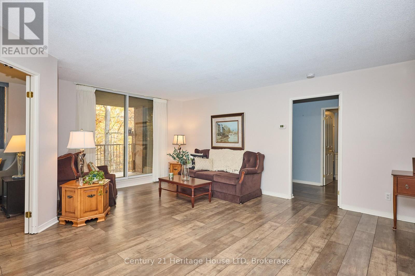 Walkout to balcony - 317 - 8111 Forest Glen Drive, Niagara Falls (Mt. Carmel), ON - Indoor Photo Showing Living Room