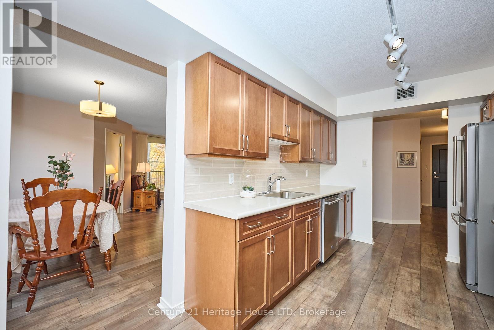 Updated Galley Kitchen - 317 - 8111 Forest Glen Drive, Niagara Falls (Mt. Carmel), ON - Indoor Photo Showing Kitchen