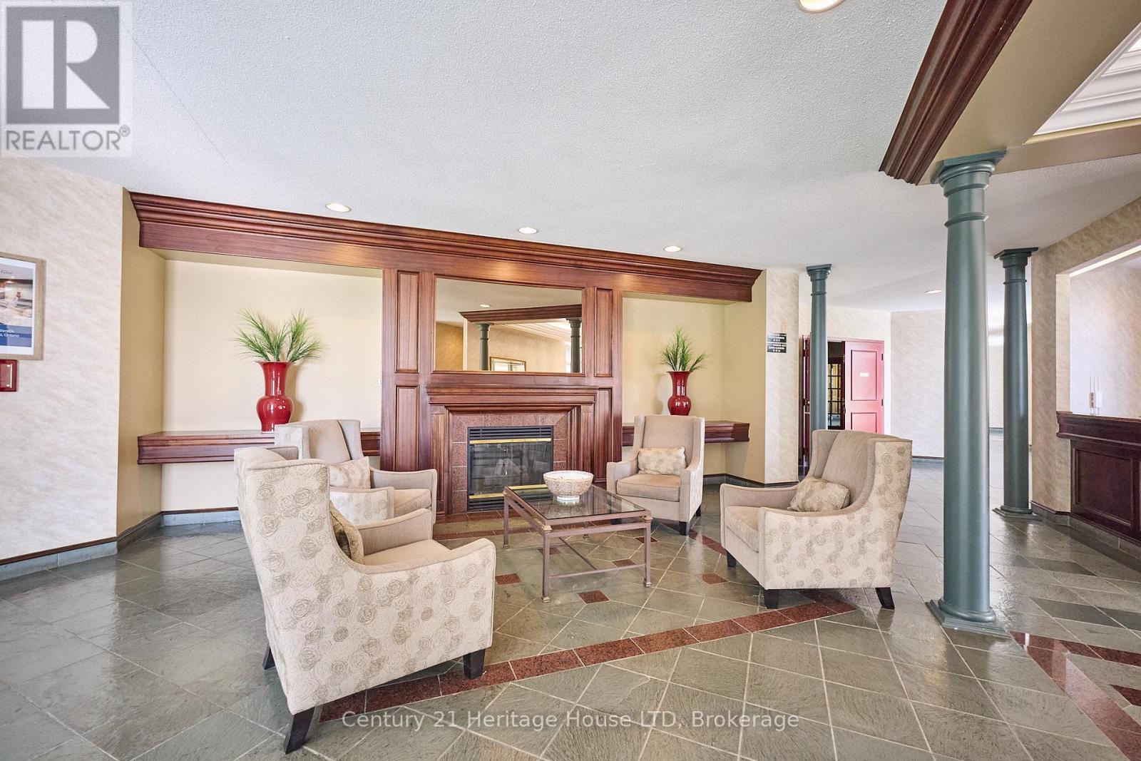 317 - 8111 Forest Glen Drive, Niagara Falls (Mt. Carmel), ON - Indoor Photo Showing Other Room With Fireplace