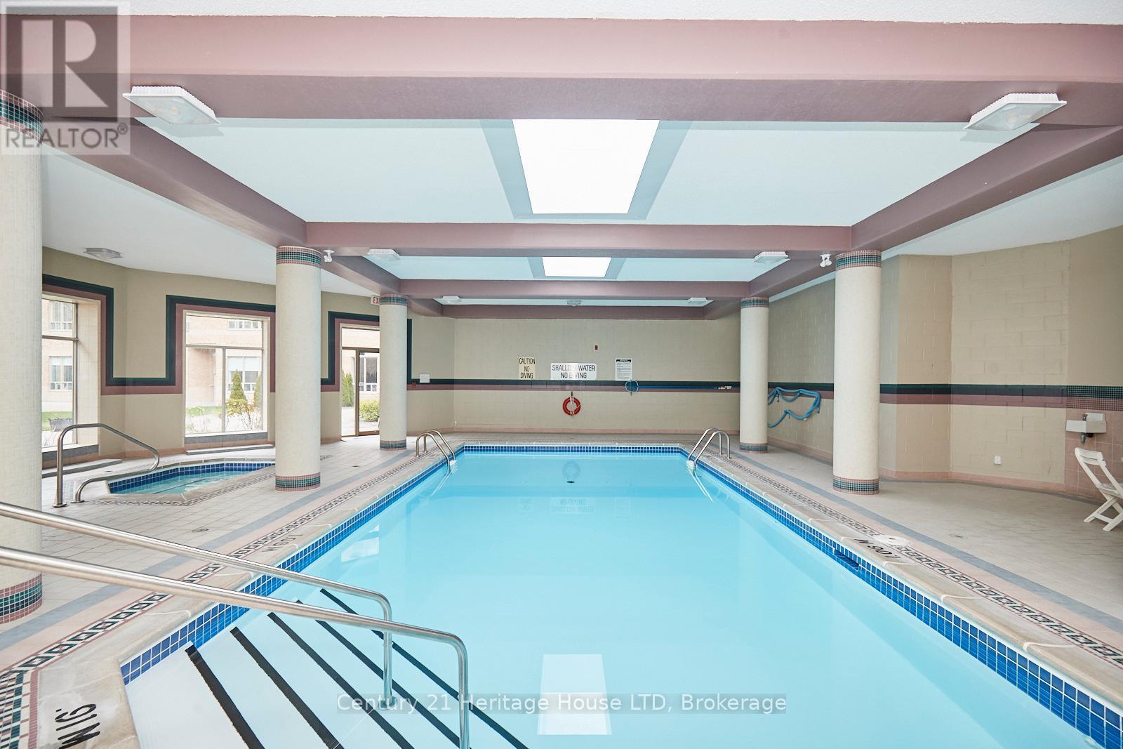 317 - 8111 Forest Glen Drive, Niagara Falls (Mt. Carmel), ON - Indoor Photo Showing Other Room With In Ground Pool