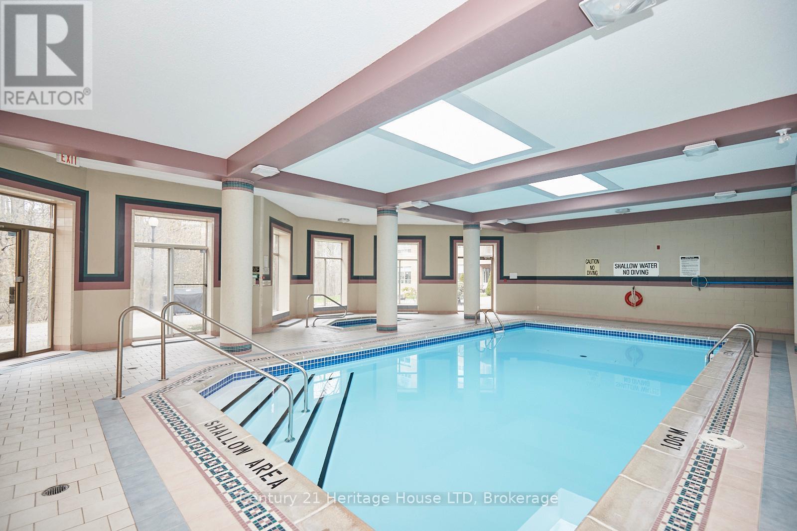 317 - 8111 Forest Glen Drive, Niagara Falls (Mt. Carmel), ON - Indoor Photo Showing Other Room With In Ground Pool