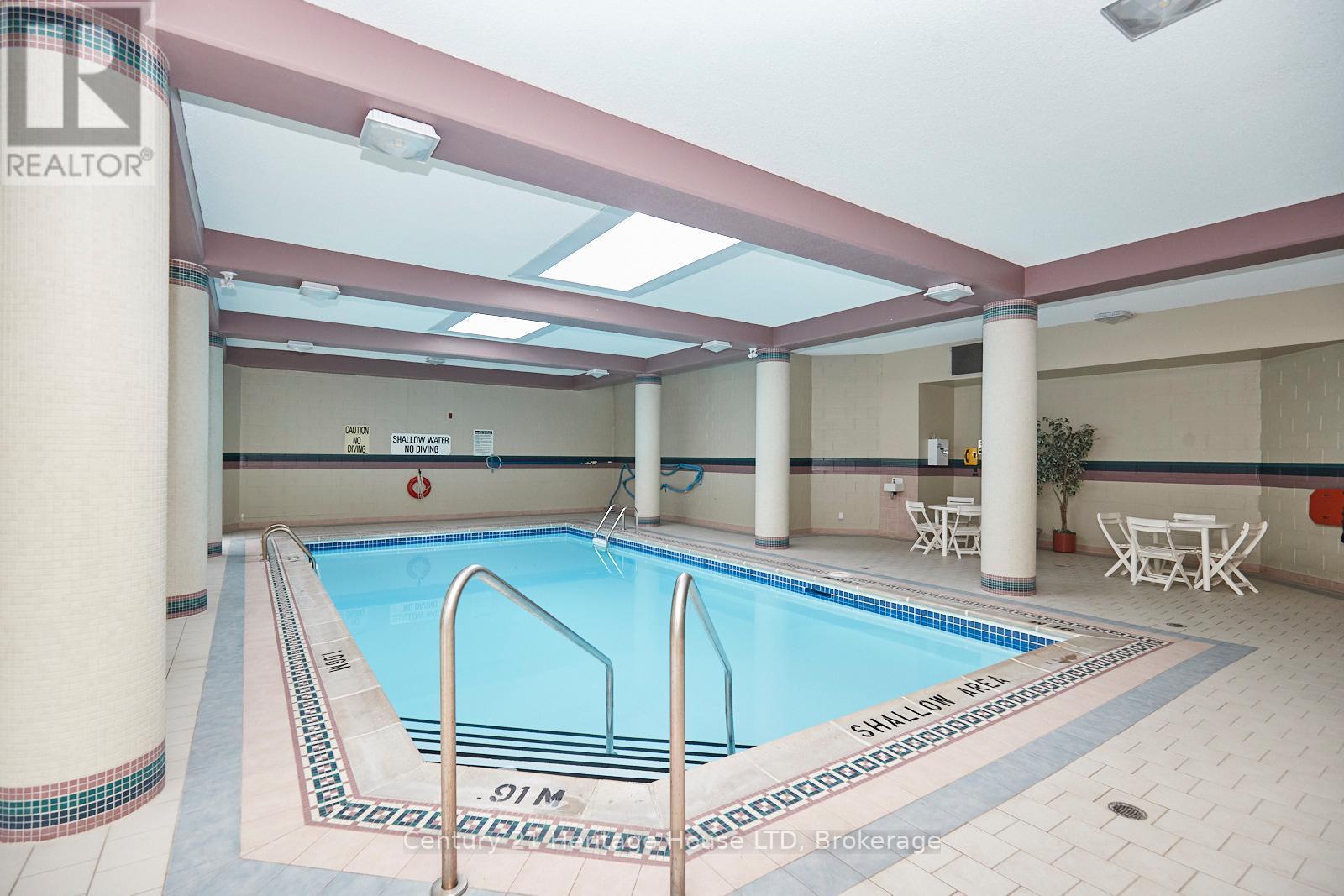 317 - 8111 Forest Glen Drive, Niagara Falls (Mt. Carmel), ON - Indoor Photo Showing Other Room With In Ground Pool