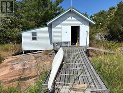 Newly Sided Boat House and Skidoo Shed -