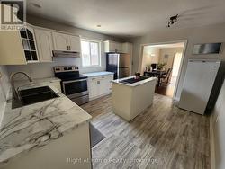 Main level: Kitchen with French doors to living rm -