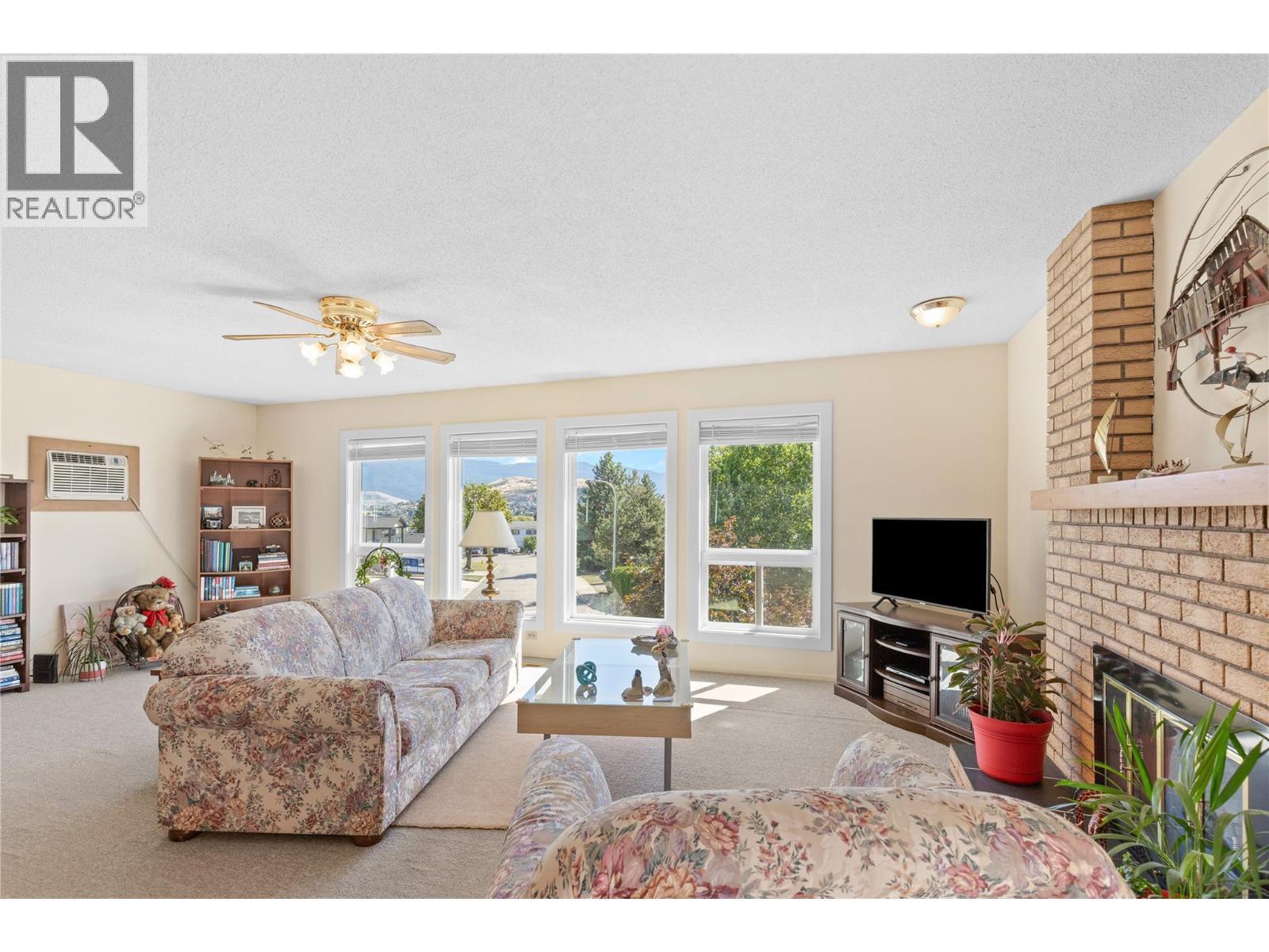 LIVING ROOM - Perfect for entertaining! - 3011 11 Street, Vernon, BC - Indoor Photo Showing Living Room With Fireplace