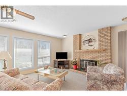 LIVINGROOM - Brick surrounded Wood-burning fireplace! -