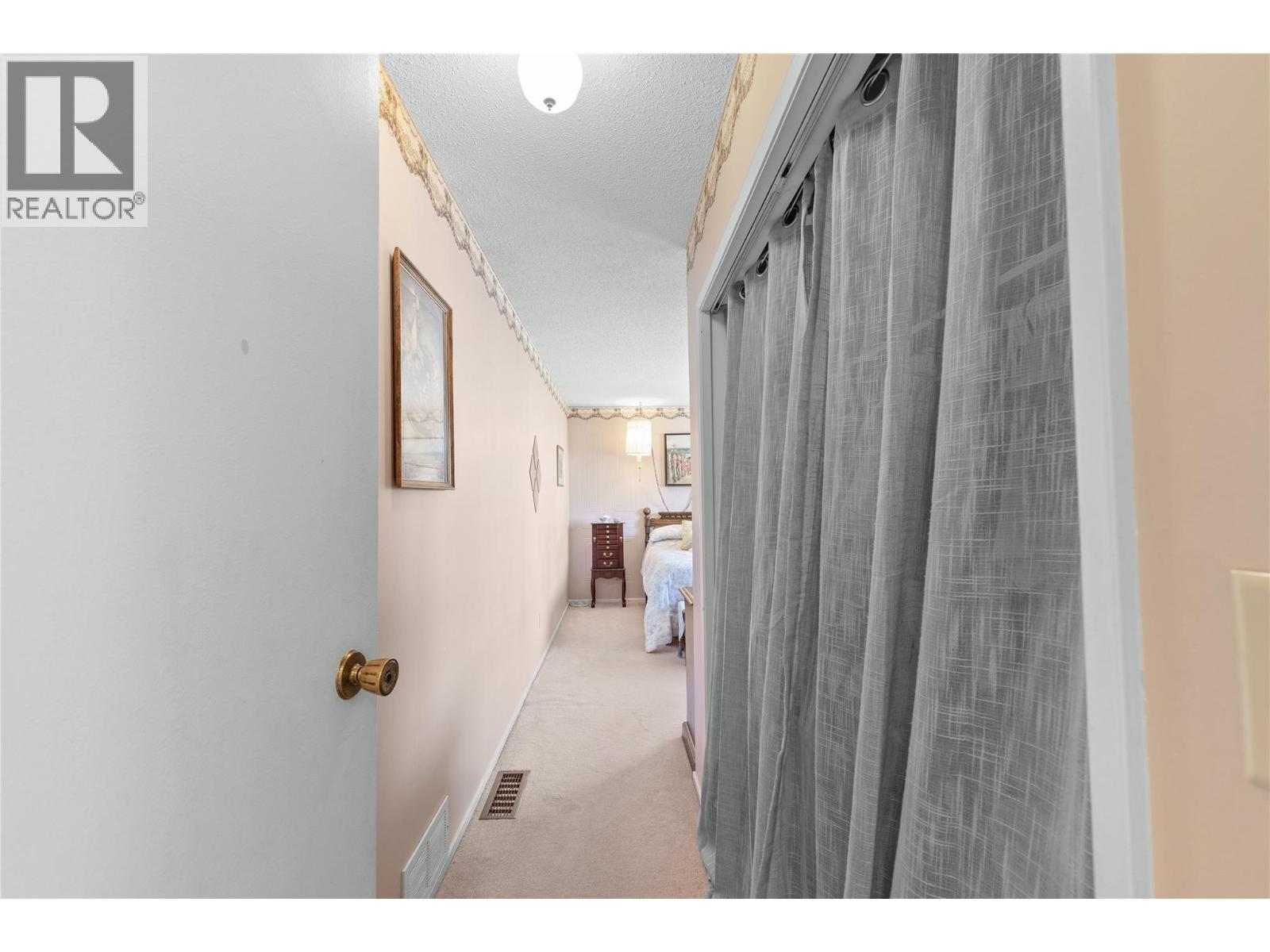 MASTER BEDROOM - Closet with elegant curtain! - 3011 11 Street, Vernon, BC - Indoor Photo Showing Other Room