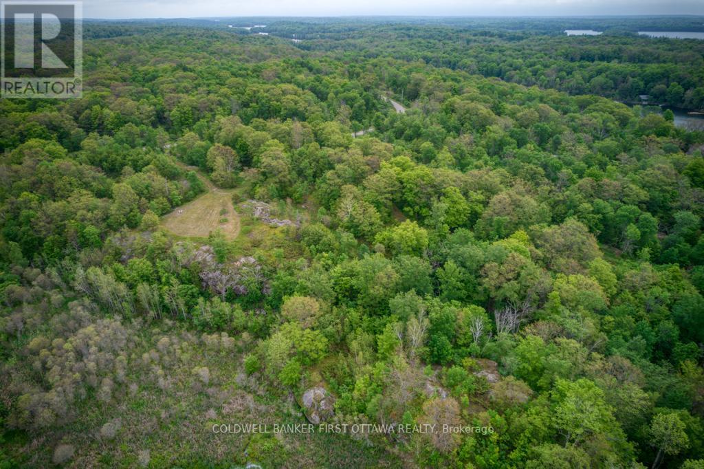 Community has 105 acres; trails abut Crown Land - 16 Grey Owl Road, Frontenac (Frontenac South), ON