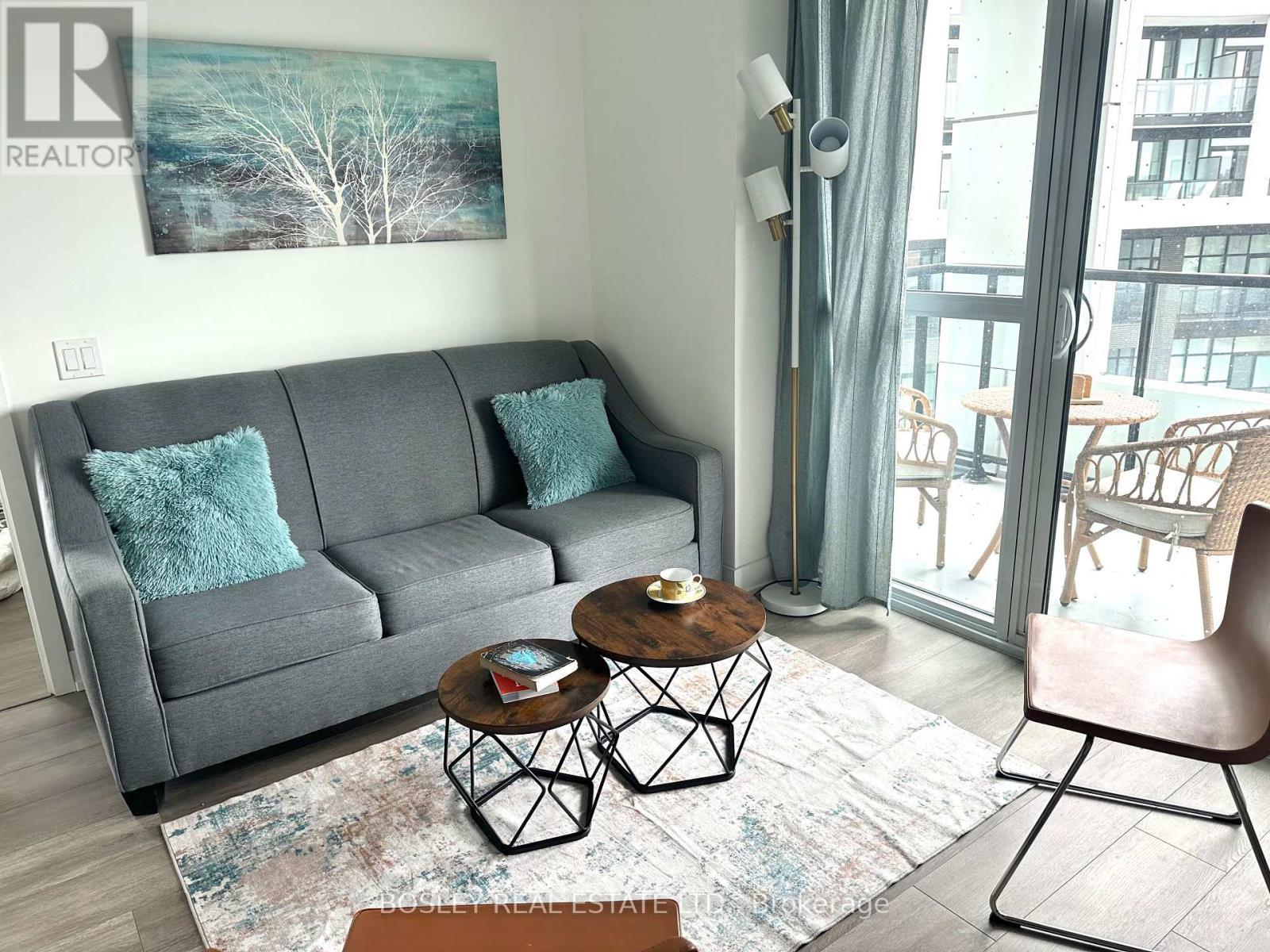 407 - 50 George Butchart Drive, Toronto, ON - Indoor Photo Showing Living Room