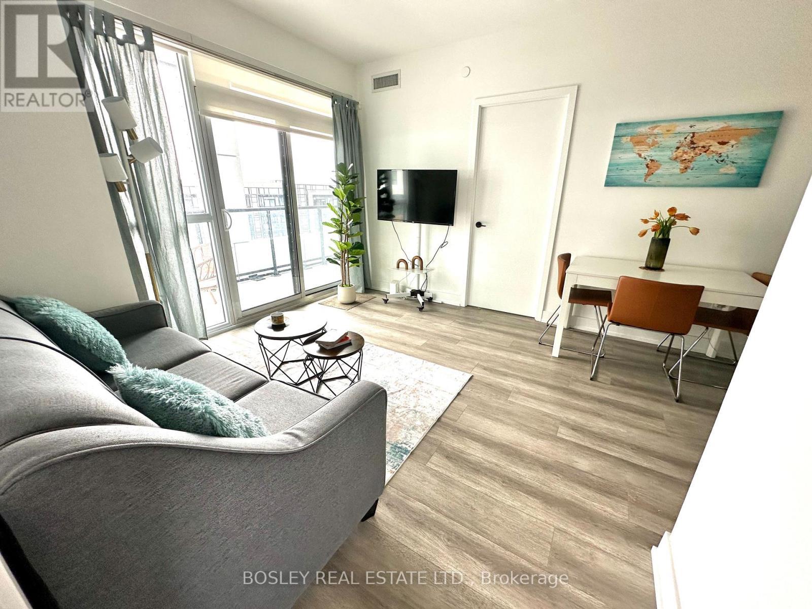 407 - 50 George Butchart Drive, Toronto, ON - Indoor Photo Showing Living Room