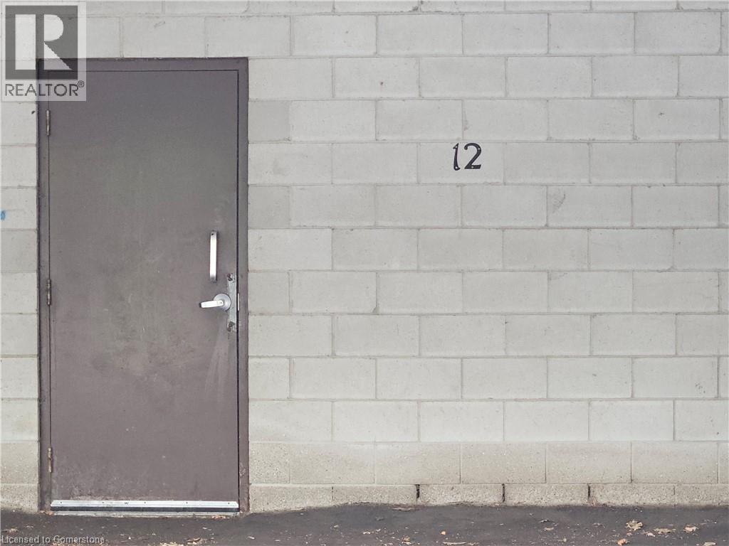 entrance door to basement of building from parking space #12 - 4 Avalon Place Unit# 102, Kitchener, ON -